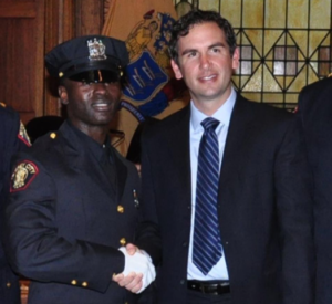 Police Officer Morton Otundo and Jersey City Mayor Steven Fulop